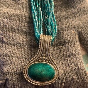 Turquoise Beaded Necklace with Intricate Silver Pendant